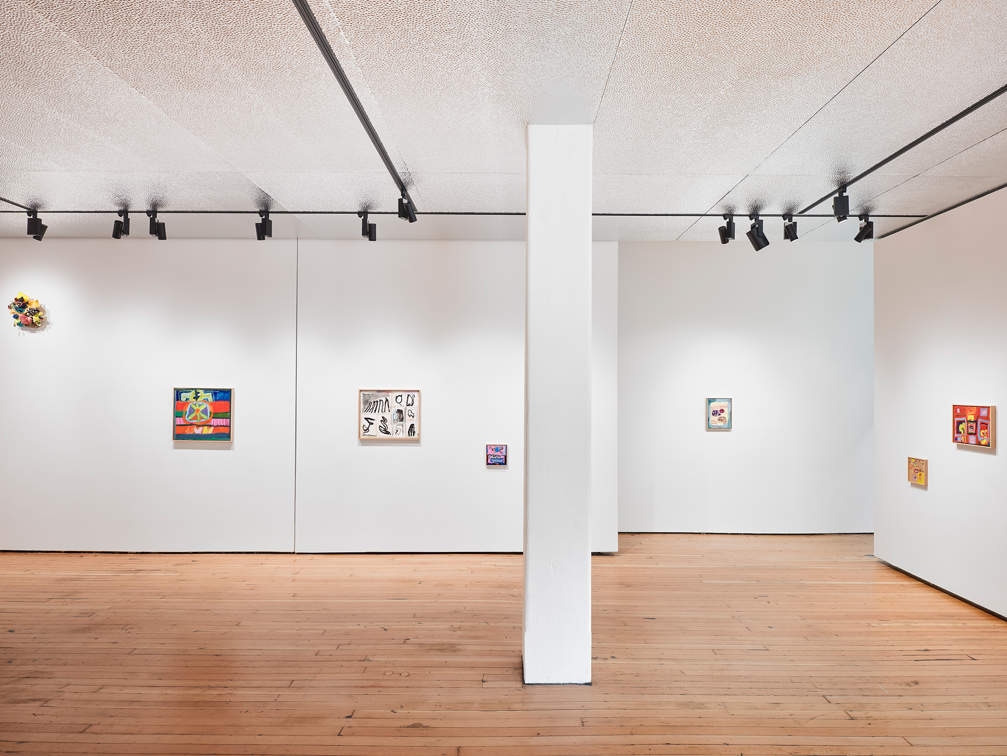 A rectangle swirl of purple marker and the a lopsided name "Tess" sits squarely in a white canvas