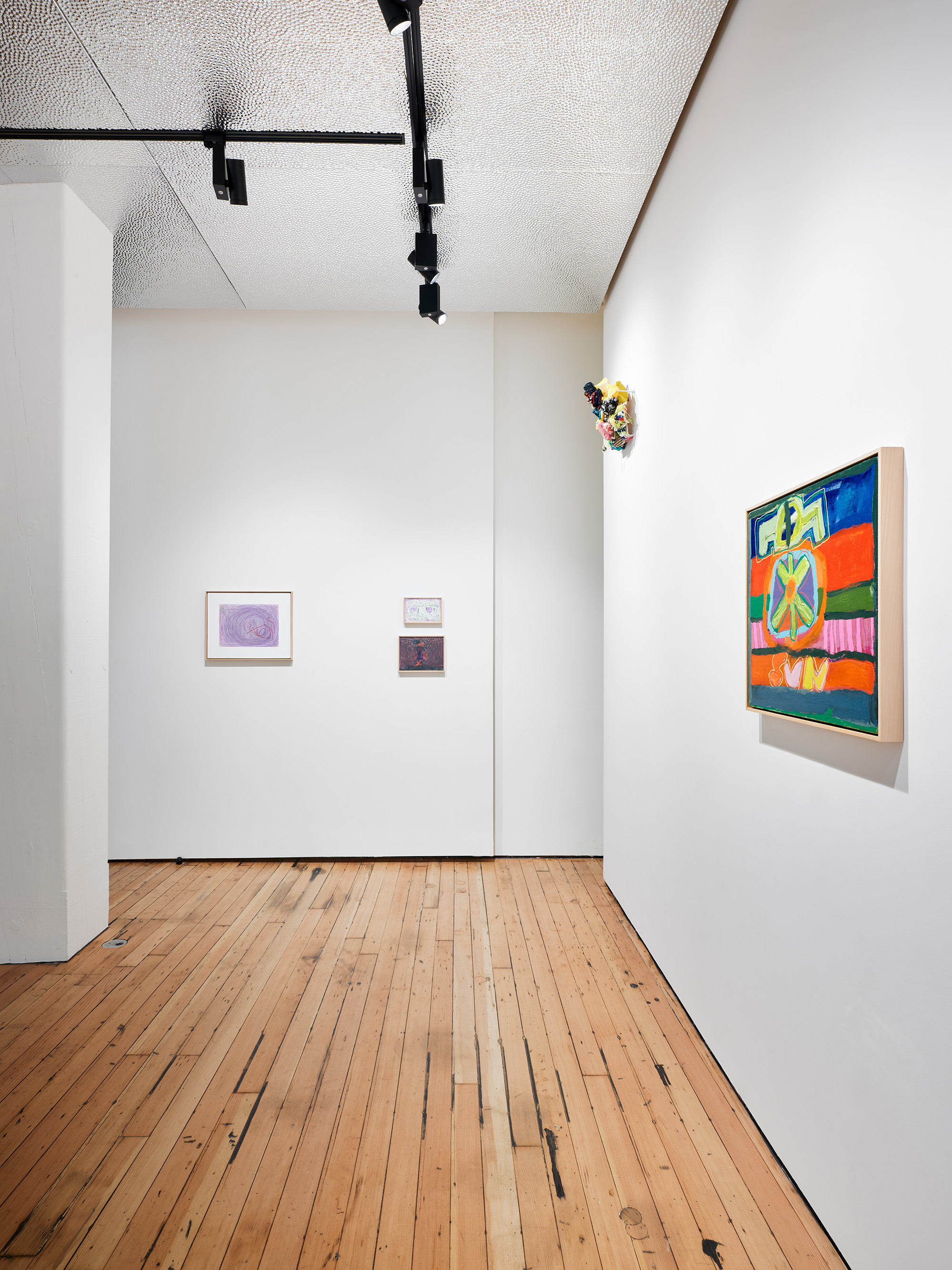 A rectangle swirl of purple marker and the a lopsided name "Tess" sits squarely in a white canvas