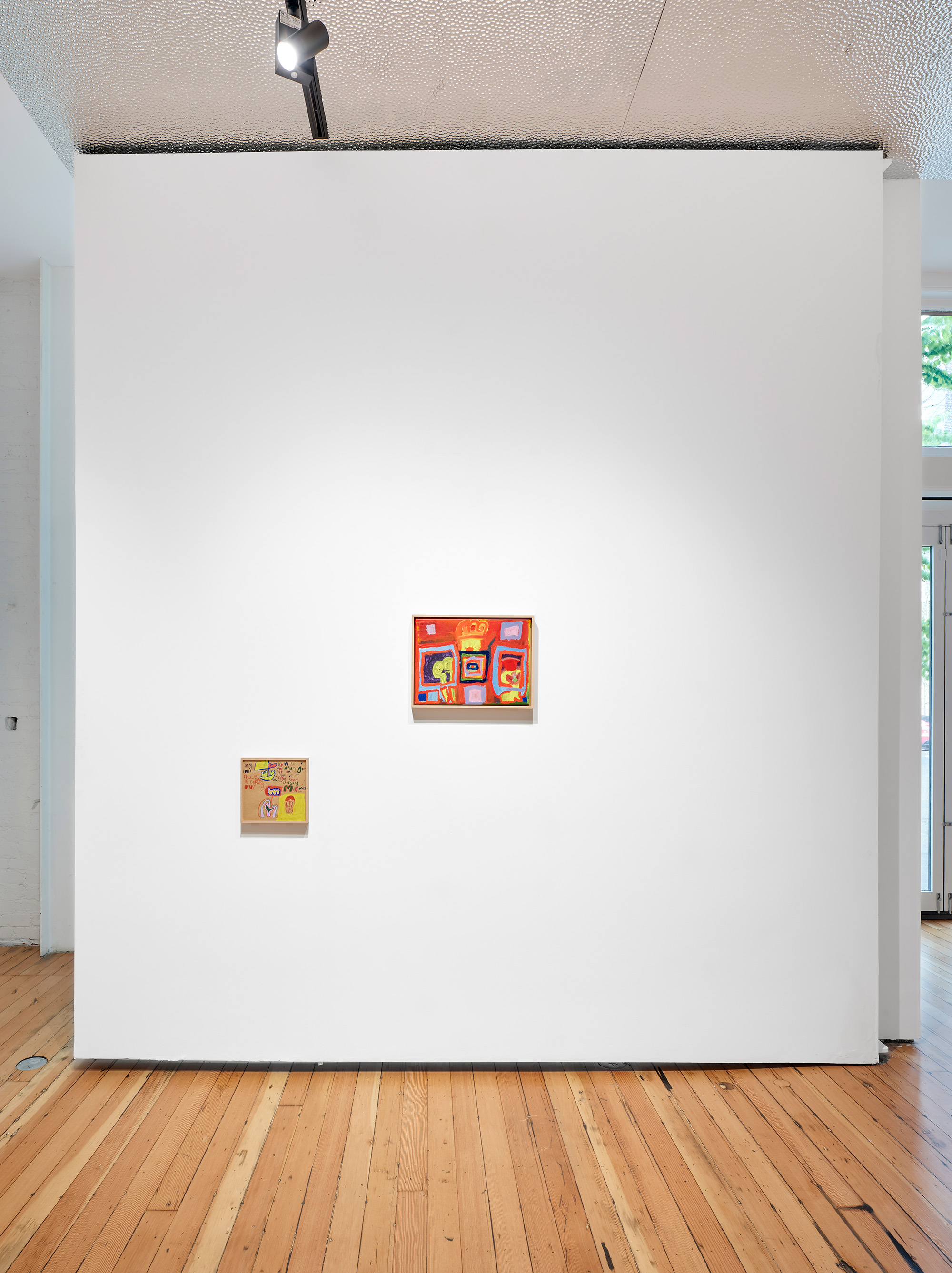 A rectangle swirl of purple marker and the a lopsided name "Tess" sits squarely in a white canvas