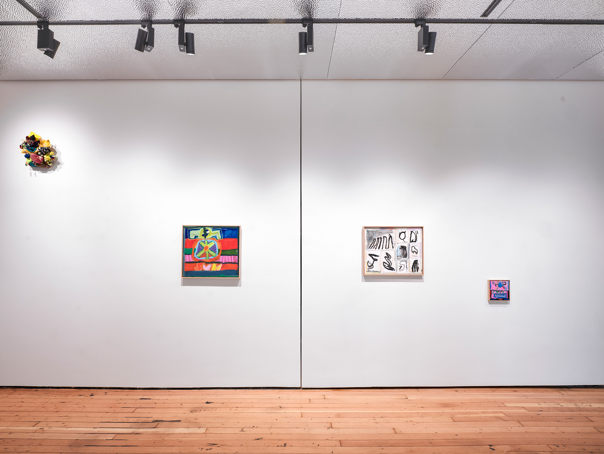 A rectangle swirl of purple marker and the a lopsided name "Tess" sits squarely in a white canvas